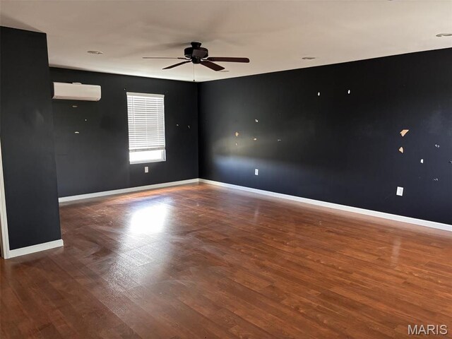 202 Reliance Rd, Foristell, MO 63385 - spare room with ceiling fan, an AC wall unit, wood finished floors, and baseboards