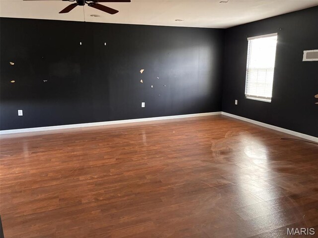 202 Reliance Rd, Foristell, MO 63385 - spare room featuring a ceiling fan, baseboards, and wood finished floors