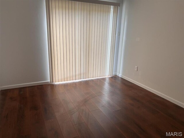 202 Reliance Rd, Foristell, MO 63385 - spare room with dark wood finished floors and baseboards