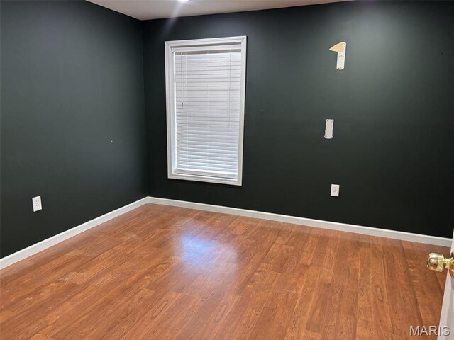 202 Reliance Rd, Foristell, MO 63385 - unfurnished room featuring wood finished floors and baseboards