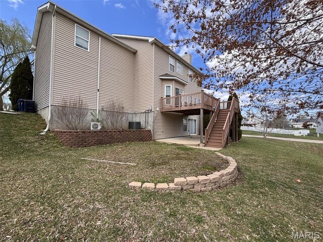 202 Reliance Rd, Foristell, MO 63385 - rear view of house featuring a wooden deck, stairs, a yard, a chimney, and a patio area