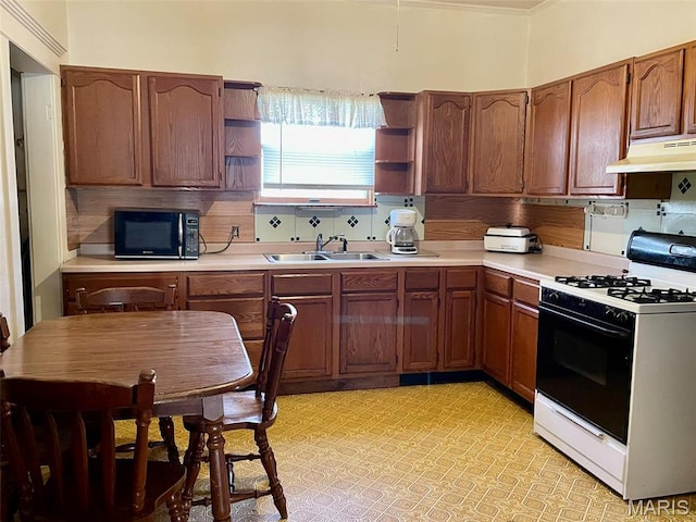 kitchen with range with gas stovetop, black microwave, open shelves, under cabinet range hood, and light countertops