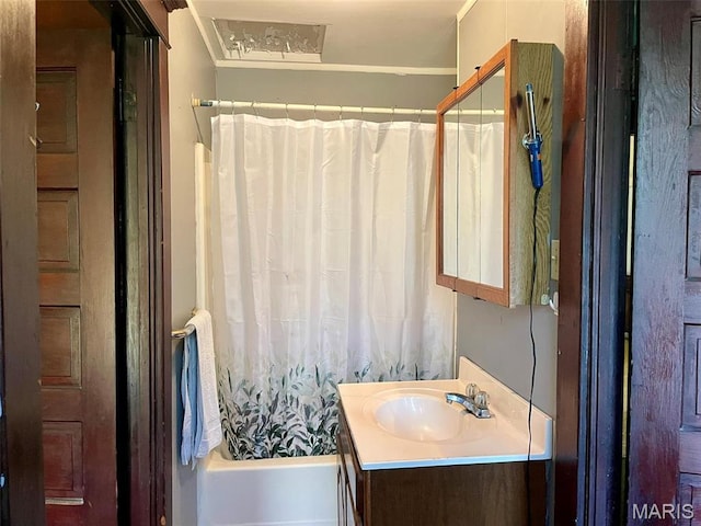 bathroom with vanity and shower / bath combo