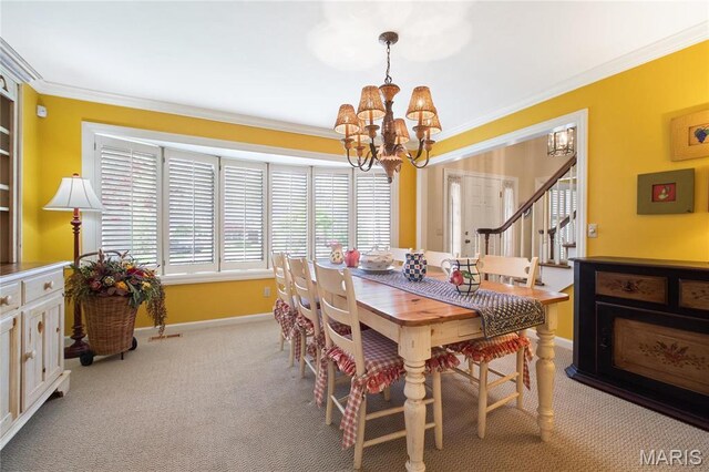 405 Seven Gables Ct, Chesterfield, MO 63017 - dining room with a chandelier, ornamental molding, baseboards, light colored carpet, and stairway