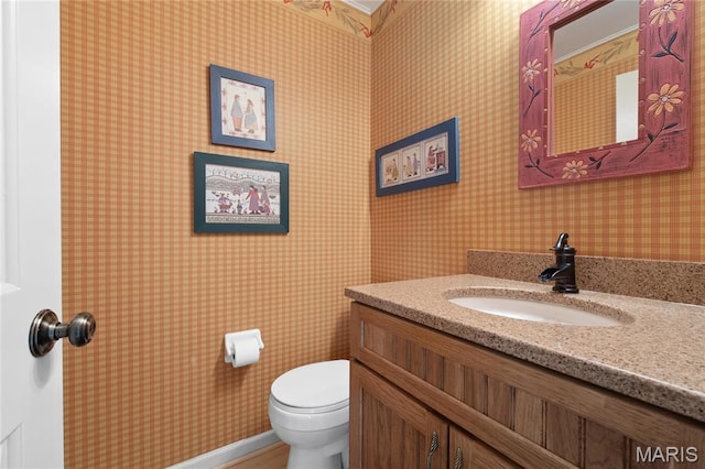 405 Seven Gables Ct, Chesterfield, MO 63017 - half bathroom featuring toilet, wallpapered walls, and vanity