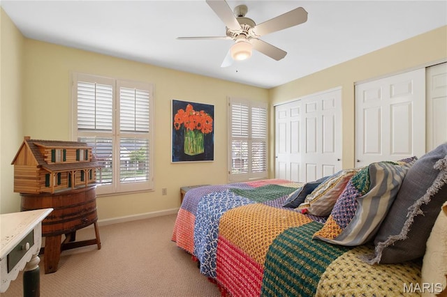 405 Seven Gables Ct, Chesterfield, MO 63017 - carpeted bedroom with baseboards, two closets, and ceiling fan