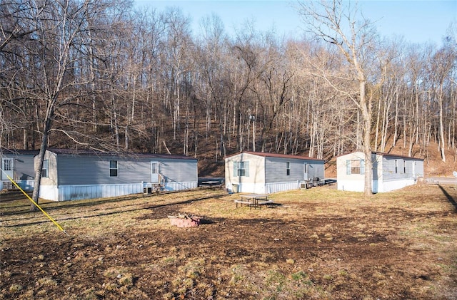 view of yard with an outbuilding and entry steps