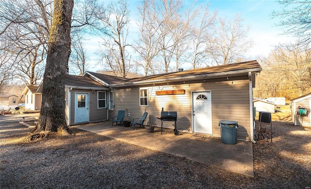 rear view of property with a patio area and central AC unit