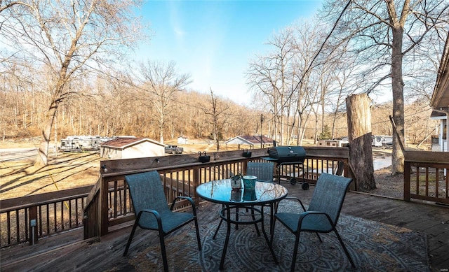 wooden deck with outdoor dining area