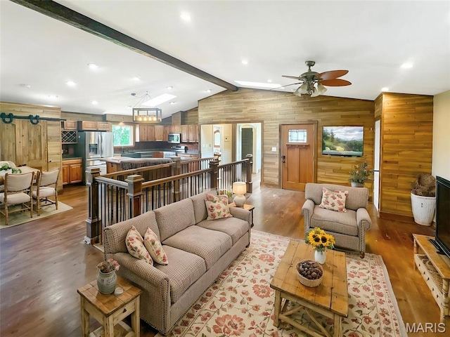 7203 Jakes Pr, Sullivan, MO 63080 - living room featuring wooden walls, wood finished floors, a ceiling fan, and recessed lighting