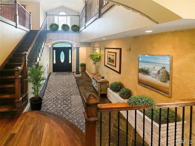 7203 Jakes Pr, Sullivan, MO 63080 - foyer with high vaulted ceiling, stairs, recessed lighting, and decorative columns