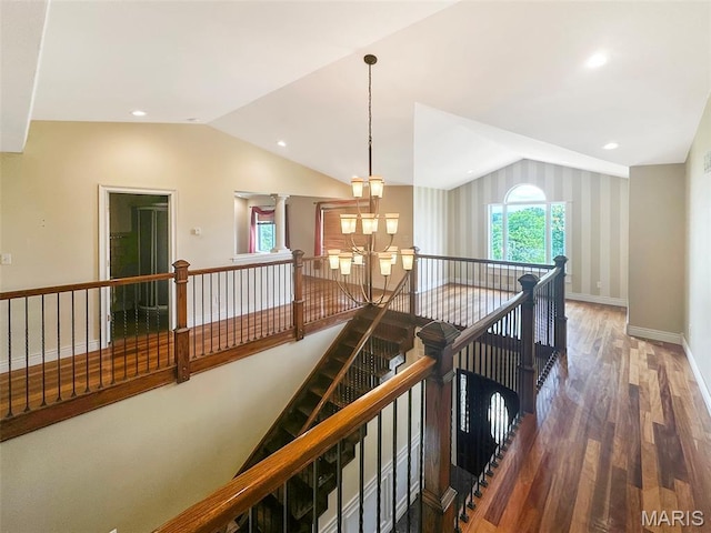 7203 Jakes Pr, Sullivan, MO 63080 - corridor with an upstairs landing, lofted ceiling, wood finished floors, a chandelier, and baseboards