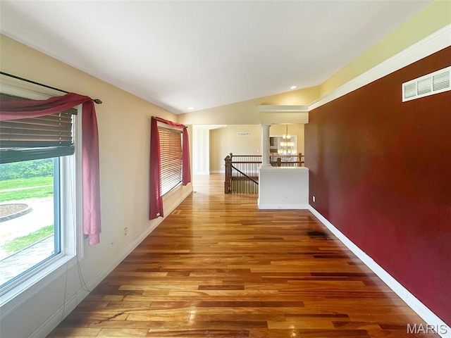 7203 Jakes Pr, Sullivan, MO 63080 - corridor featuring light wood-type flooring, baseboards, a chandelier, and ornate columns