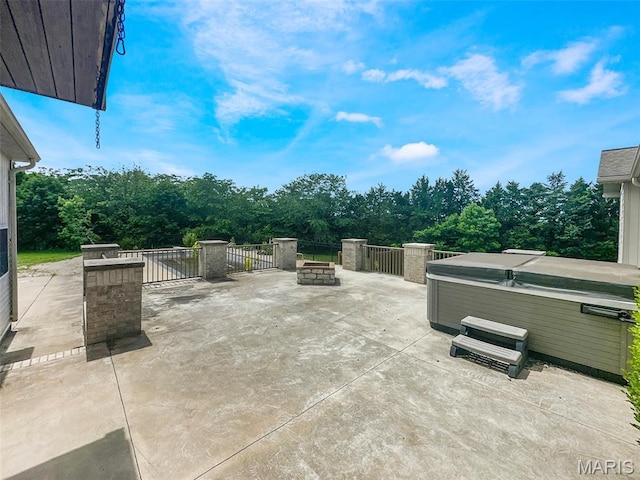 7203 Jakes Pr, Sullivan, MO 63080 - view of patio / terrace with a hot tub and a fire pit