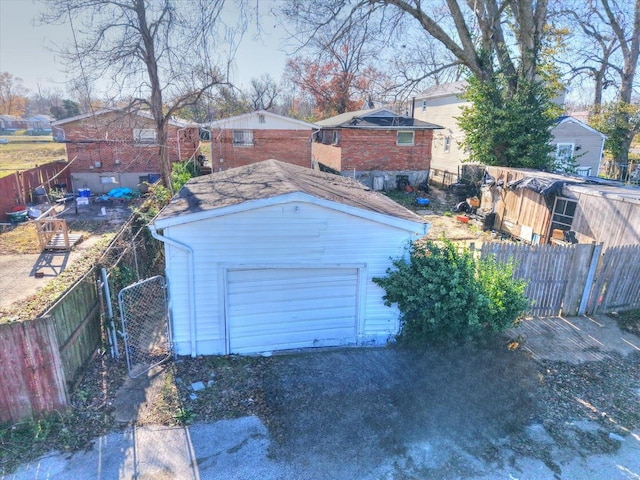 5555 Labadie, Saint Louis, MO 62120 - detached garage featuring fence, dirt driveway, and a gate