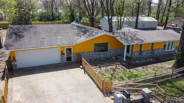 708 E Candy Cane Ln, West Frankfort, IL 62896 - view of front facade featuring stone siding, a garage, driveway, and a chimney