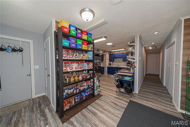 708 E Candy Cane Ln, West Frankfort, IL 62896 - misc room with a textured ceiling and wood finished floors