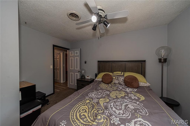 708 E Candy Cane Ln, West Frankfort, IL 62896 - carpeted bedroom featuring a textured ceiling and a ceiling fan