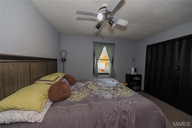 708 E Candy Cane Ln, West Frankfort, IL 62896 - carpeted bedroom featuring a textured ceiling and a ceiling fan