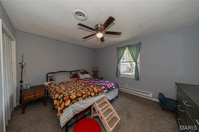 708 E Candy Cane Ln, West Frankfort, IL 62896 - bedroom featuring a baseboard heating unit, carpet, a textured ceiling, and a ceiling fan