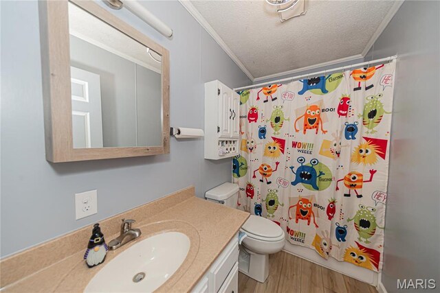 708 E Candy Cane Ln, West Frankfort, IL 62896 - full bath featuring crown molding, vanity, wood finished floors, and a textured ceiling