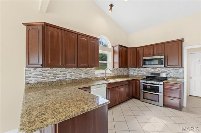 13374 Wintergreen Estates Dr, Fenton, MO 63026 - kitchen featuring stainless steel appliances, stone counters, high vaulted ceiling, and backsplash