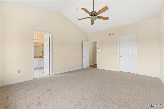 13374 Wintergreen Estates Dr, Fenton, MO 63026 - unfurnished bedroom featuring light carpet, lofted ceiling, and connected bathroom