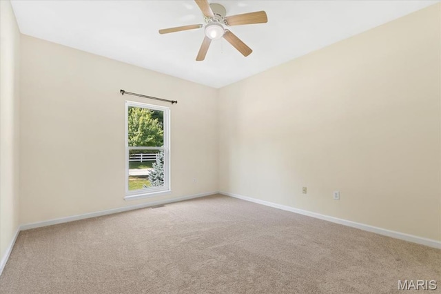 13374 Wintergreen Estates Dr, Fenton, MO 63026 - carpeted spare room with baseboards and a ceiling fan