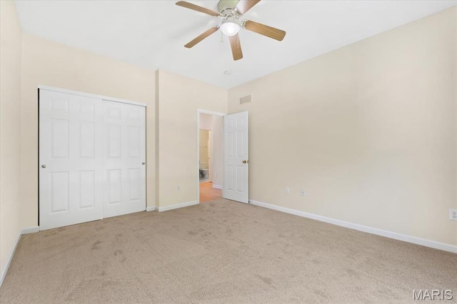 13374 Wintergreen Estates Dr, Fenton, MO 63026 - unfurnished bedroom with carpet flooring, a closet, and a ceiling fan