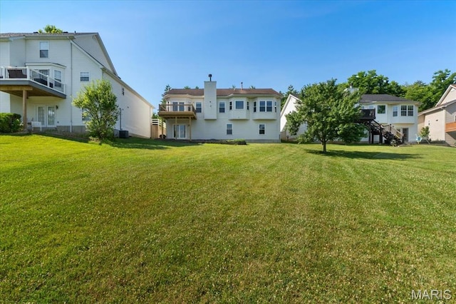13374 Wintergreen Estates Dr, Fenton, MO 63026 - rear view of property with a lawn and a chimney