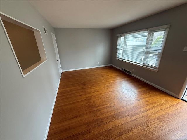 1418 Broadlawns Ln, Saint Louis, MO 63138 - unfurnished room featuring wood finished floors and baseboards