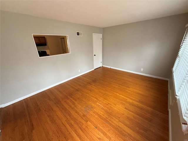 1418 Broadlawns Ln, Saint Louis, MO 63138 - unfurnished room featuring baseboards and wood finished floors