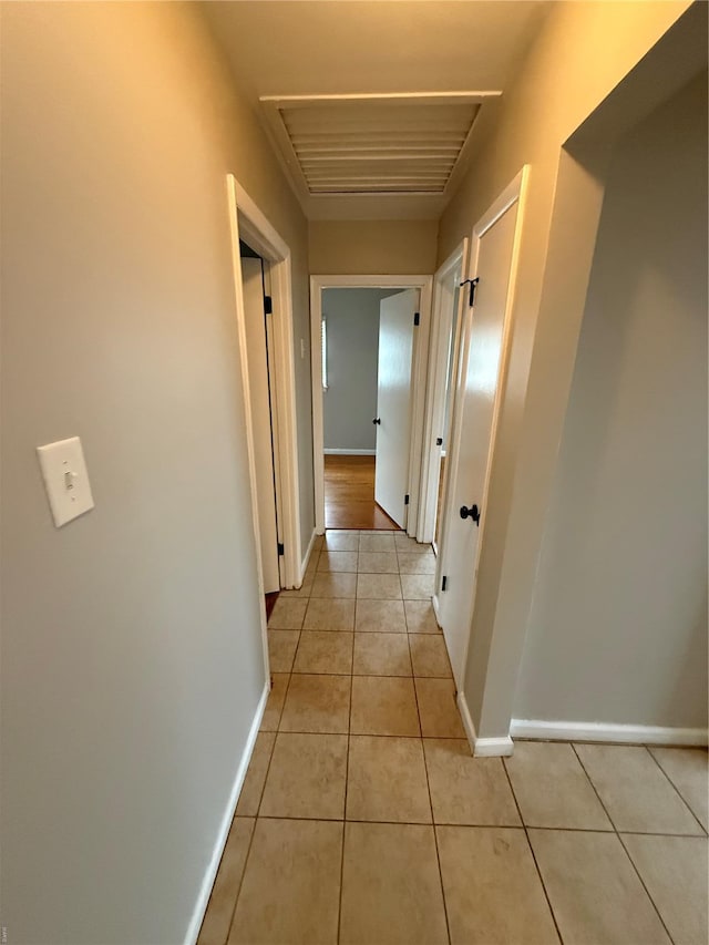 1418 Broadlawns Ln, Saint Louis, MO 63138 - corridor featuring light tile patterned floors and baseboards