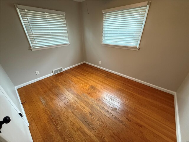 1418 Broadlawns Ln, Saint Louis, MO 63138 - spare room featuring wood finished floors and baseboards