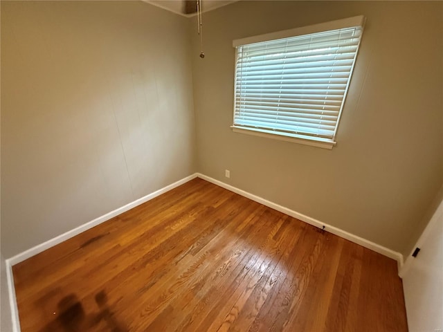 1418 Broadlawns Ln, Saint Louis, MO 63138 - spare room featuring baseboards and wood finished floors