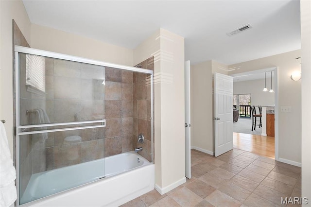 152 Geneva Cove Dr, Innsbrook, MO 63390 - bathroom featuring baseboards and bath / shower combo with glass door