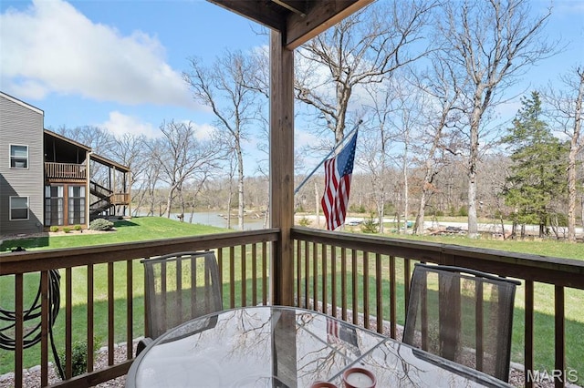 152 Geneva Cove Dr, Innsbrook, MO 63390 - wooden terrace with outdoor dining space, a water view, and a yard