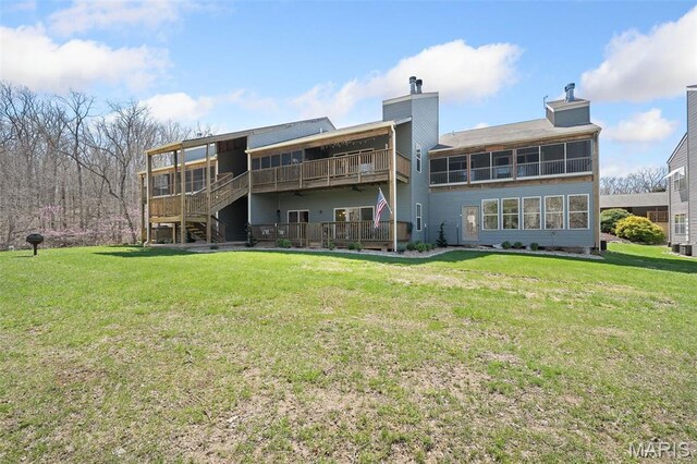 152 Geneva Cove Dr, Innsbrook, MO 63390 - back of house featuring a yard, a wooden deck, and a chimney
