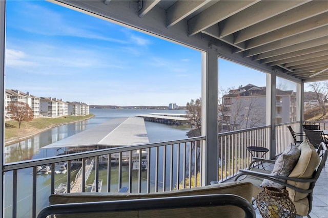 balcony featuring a water view