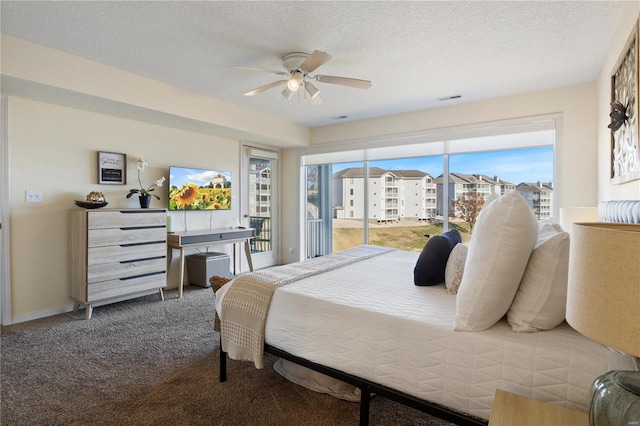 carpeted bedroom with a textured ceiling, ceiling fan, and access to exterior