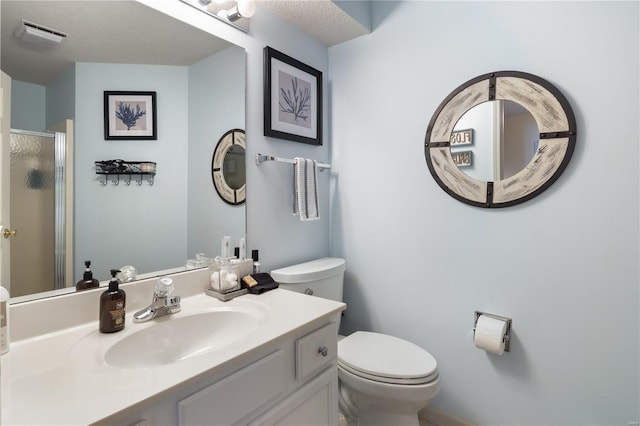 full bath with toilet, a stall shower, and vanity