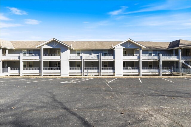 view of property with uncovered parking