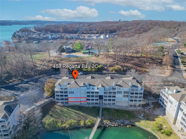 aerial view of a large body of water and apartment complex / building