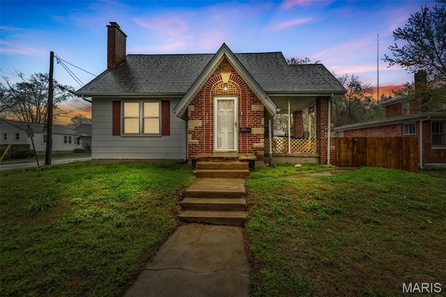 399 Roberts St, Saint Genevieve, MO 63670 - view of front of house with a chimney, a shingled roof, and brick siding