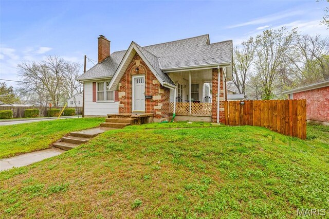 399 Roberts St, Saint Genevieve, MO 63670 - view of front of home featuring a chimney, a shingled roof, and brick siding