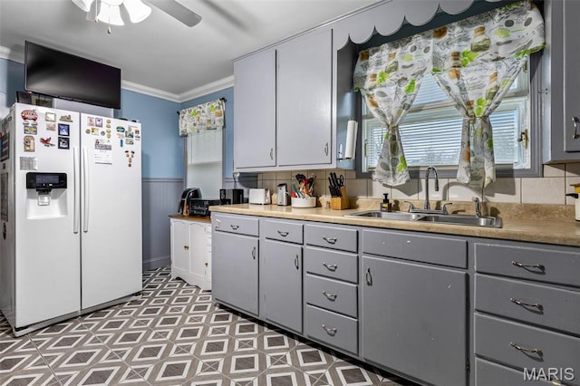 399 Roberts St, Saint Genevieve, MO 63670 - kitchen featuring white fridge with ice dispenser, gray cabinetry, a sink, ornamental molding, and a ceiling fan