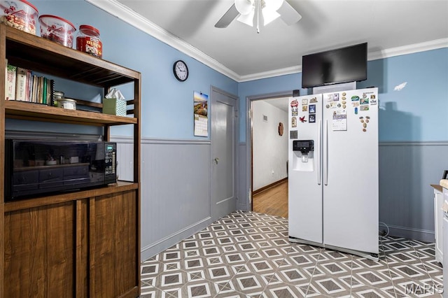 399 Roberts St, Saint Genevieve, MO 63670 - kitchen with white refrigerator with ice dispenser, black microwave, tile patterned floors, crown molding, and a ceiling fan