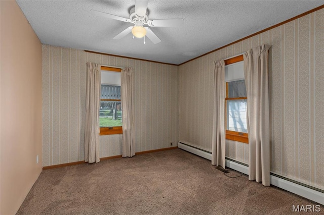 204 E 3rd N St, Mount Olive, IL 62069 - carpeted spare room featuring healthy amount of natural light, ceiling fan, a textured ceiling, ornamental molding, and baseboard heating