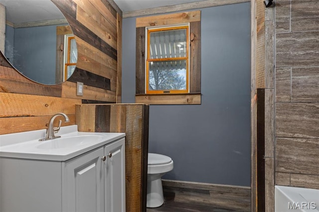 204 E 3rd N St, Mount Olive, IL 62069 - bathroom with wood finished floors, toilet, vanity, baseboards, and wooden walls