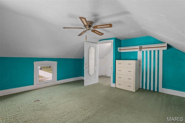 204 E 3rd N St, Mount Olive, IL 62069 - additional living space with carpet floors, lofted ceiling, a textured ceiling, ceiling fan, and baseboards